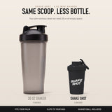 Shake Shot 4 oz mini shaker in black shown beside a 20 oz shaker bottle for size comparison